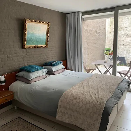 Lounge In The Intimate Urban Garden At A Retro Getaway *